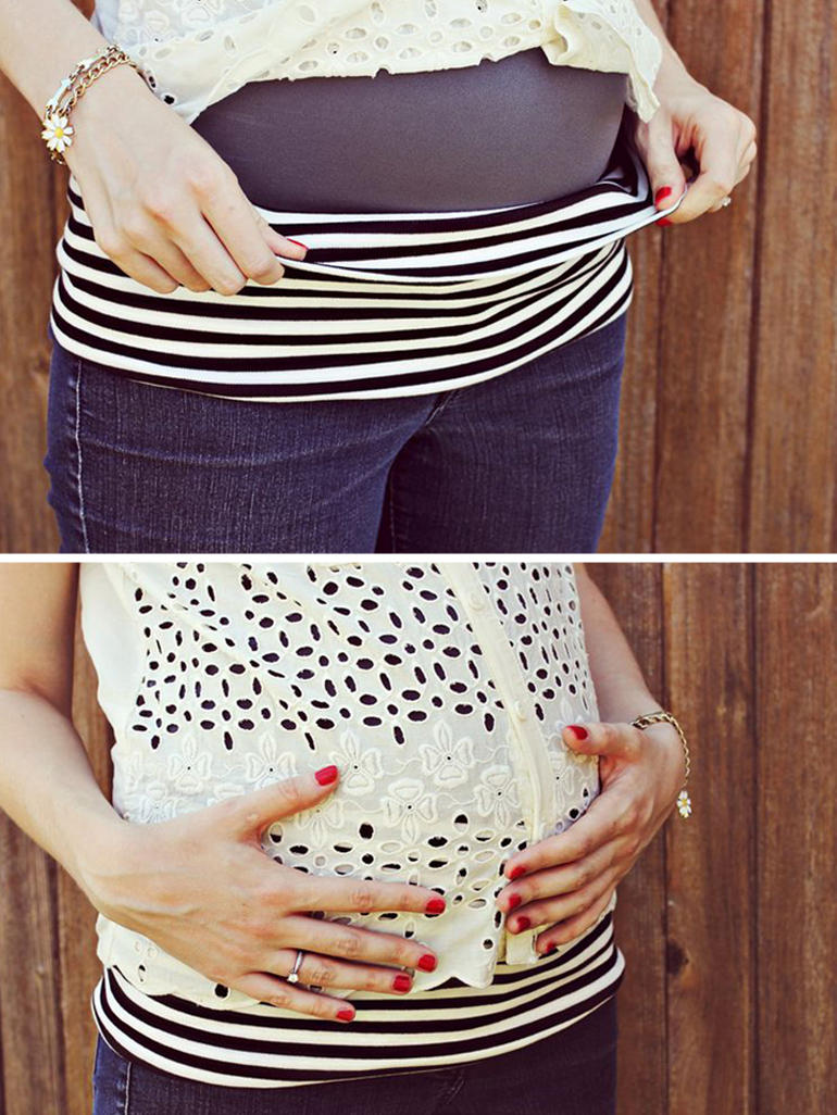 pregnant stomach with stretchy clothing pulled over baby bump
