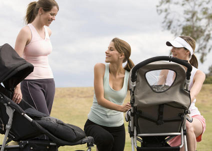 three women outdoor at a stroller exercise class