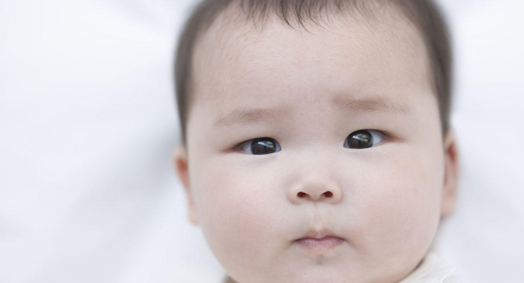 infant with pensive look on face