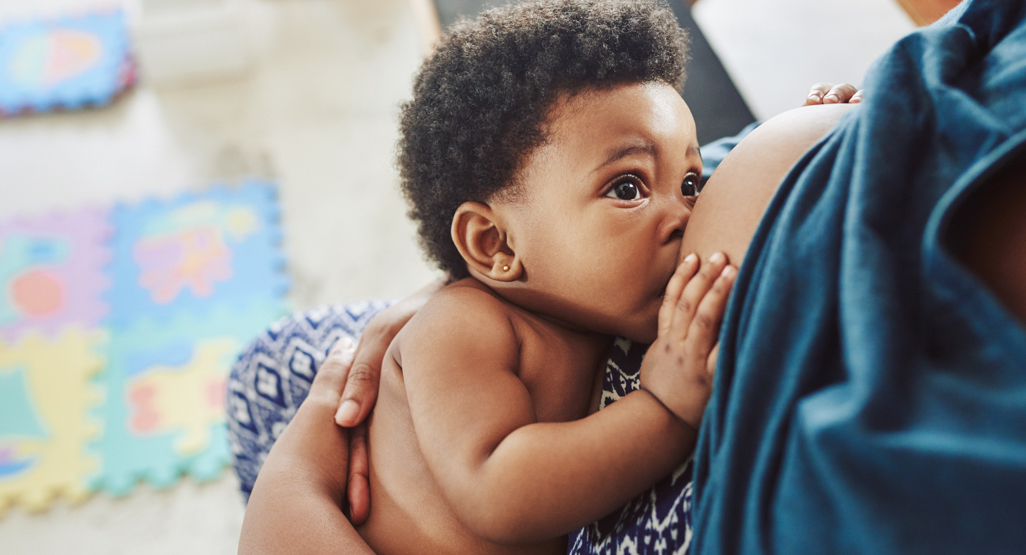 woman breastfeeding baby