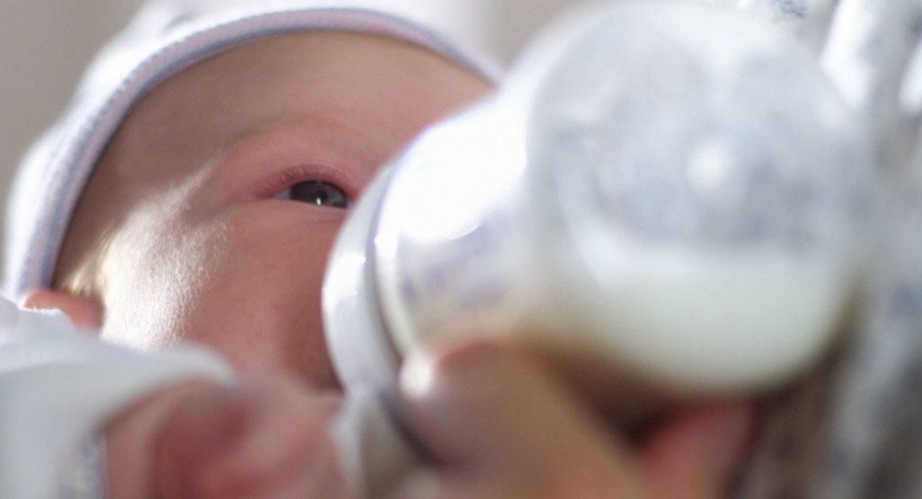 baby feeding from bottle