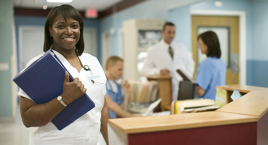 woman doctor in a hospital, holding a folder