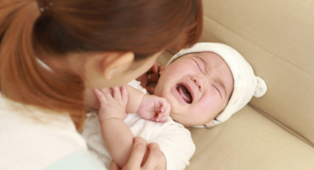 baby crying during a diaper change