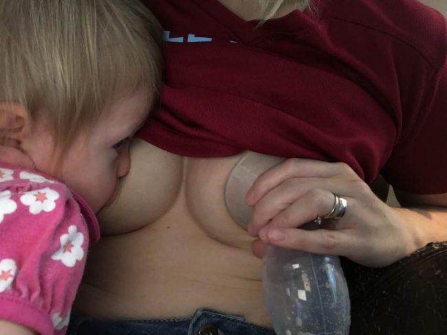 A woman uses the Haakaa breast pump in this image 