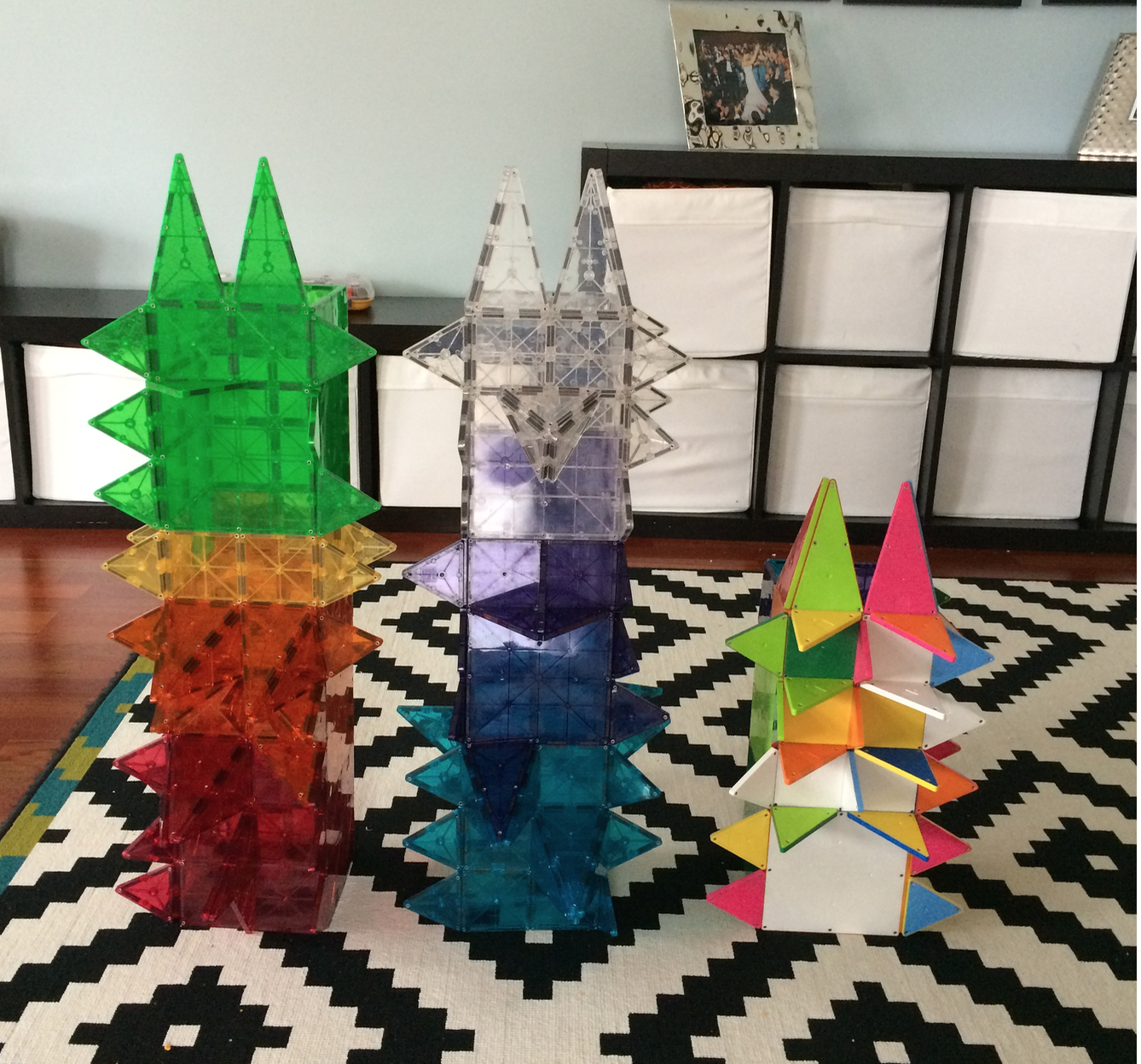three building towers made of magna tiles