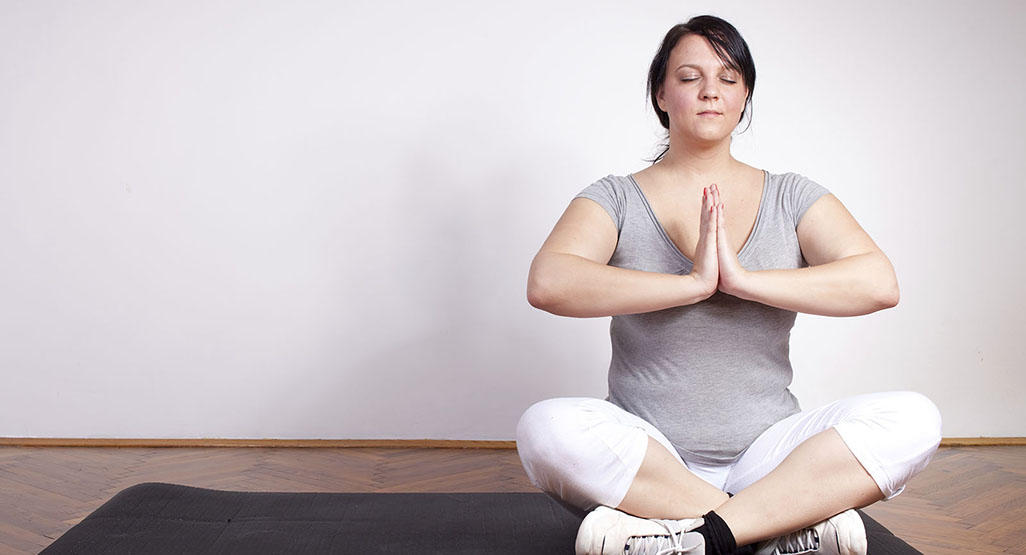 woman meditating in a yoga pose