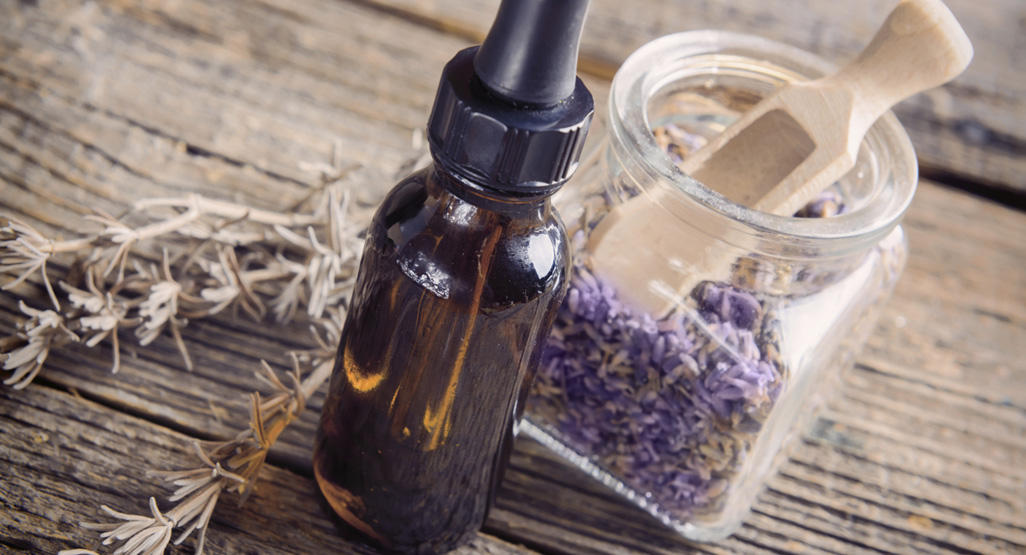 bottle of drops and jar of aromatic bath herb