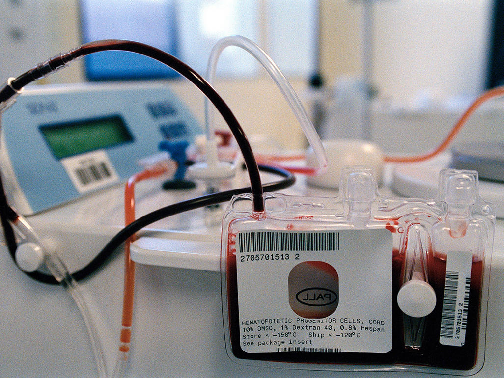 vials of blood hooked to machine through tubes