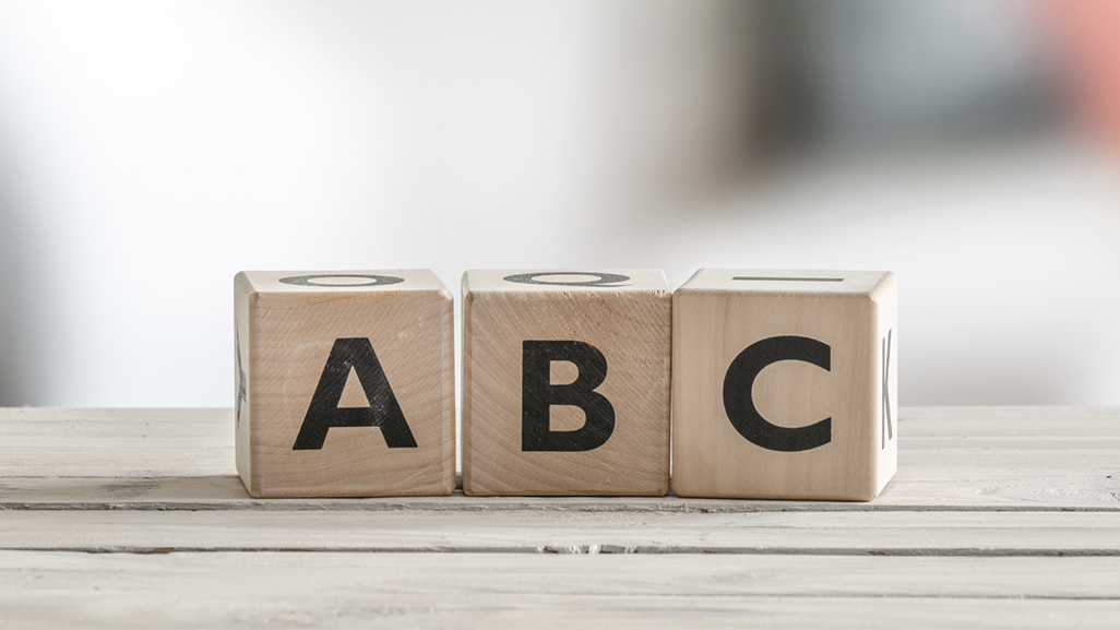 wooden blocks saying A, B, C