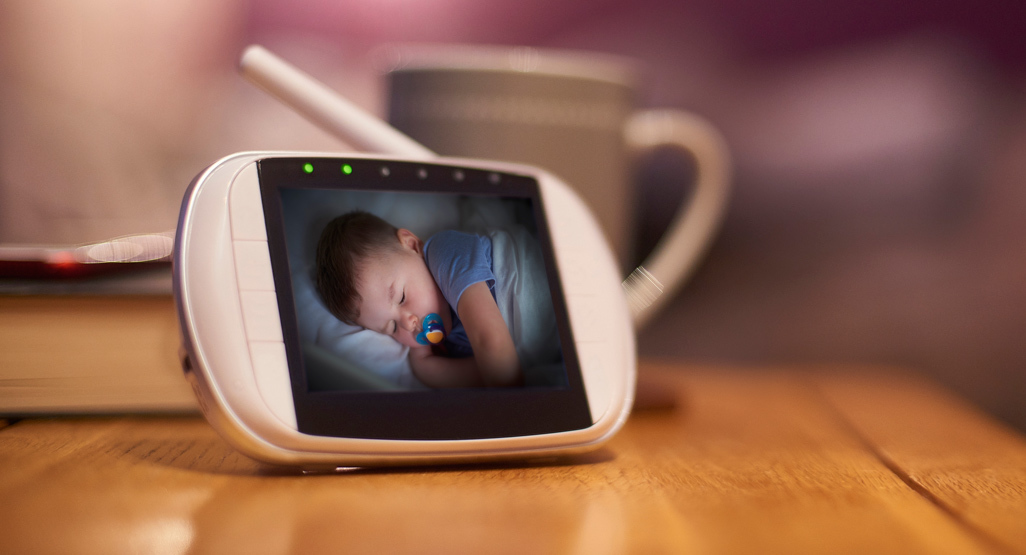 Sleeping baby in a baby monitor