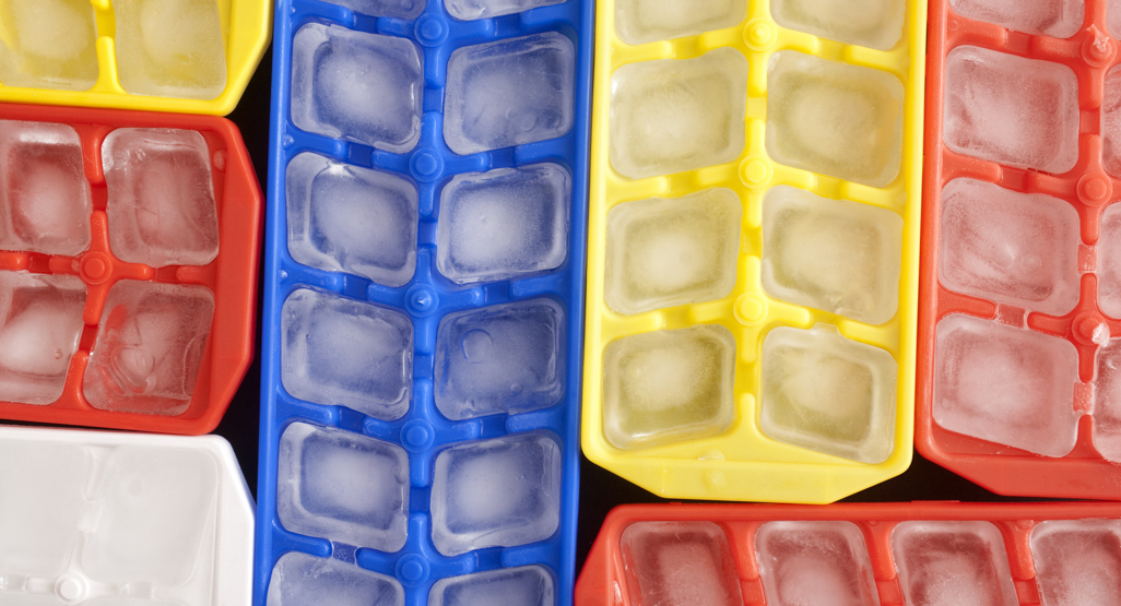 Colorful ice trays in a refrigerator