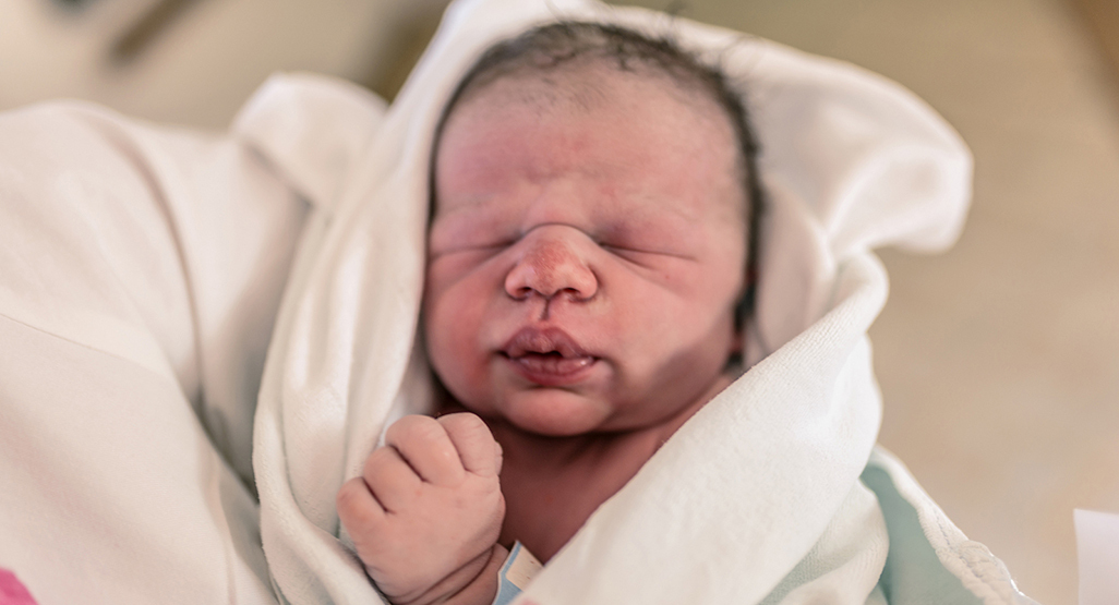 newborn baby wrapped up in cloth